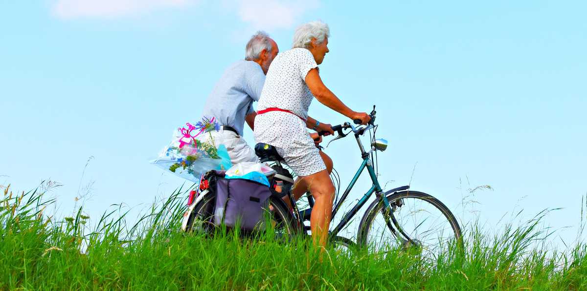 Aging in place featpic - senior couple bicycling