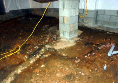 Dirty wet crawl space needs renovation